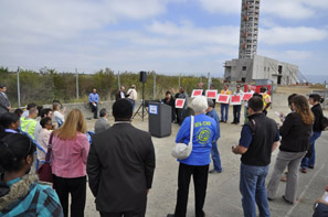 News conference in front of partially constructed FAA air traffic control tower
