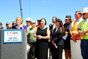 U.S. Senator Barbara Boxer speaking at Oakland International Airport with Oakland Mayor Jean Quan, Port Commission President Pamela Calloway, Port Commissioner Victor Uno, Alameda Labor Council Executive Secretary-Treasurer Josie Camacho along with dozens of other community and labor leaders.